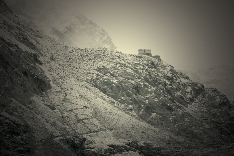 Artsy shot of Moiry lodge perched on a cliff, Valais